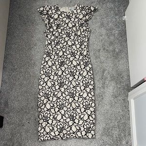 Cream dress with small sleeves and floral overlay